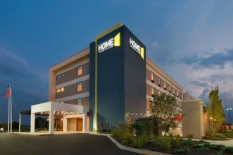 Home2 Suites by Hilton Project in Shepherdsville, KY, highlighting modern and clean accommodations. This four story hotel has well kept grounds and spacious parking.