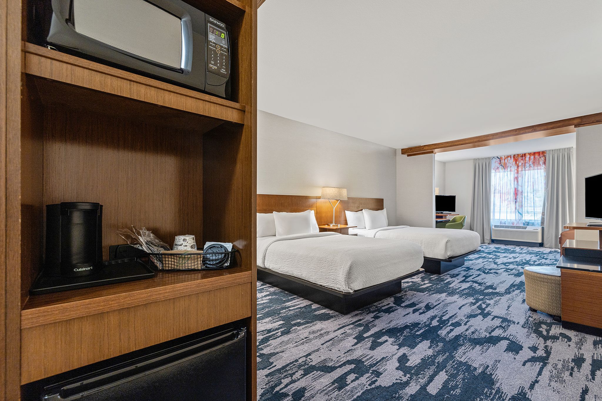 Spacious queen room suite at Nashville hotel for groups with two beds and separate living area at Fairfield Inn MetroCenter