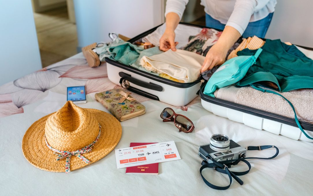 Woman packing suitcase for a trip in Nashville.