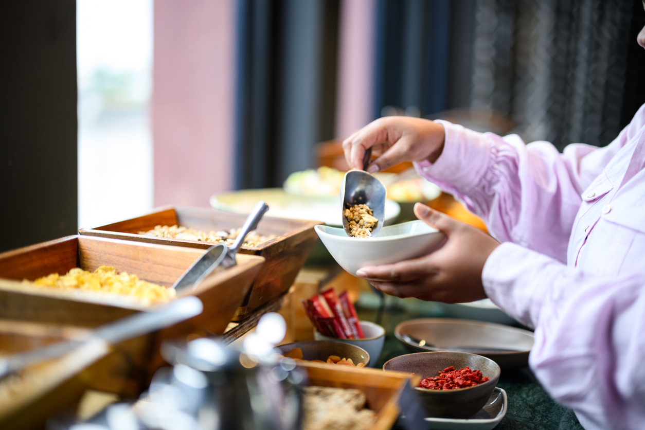 Hot breakfast buffet at Fairfield Inn & Suites Nashville MetroCenter featuring waffles, eggs, and fresh fruit for hotel guests.