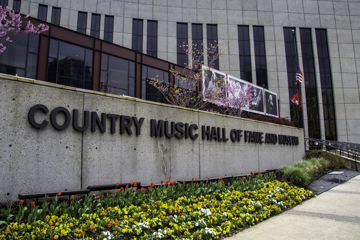 Country Music Hall of Fame in spring Nashville with blue skies and blooming trees near downtown Broadway
