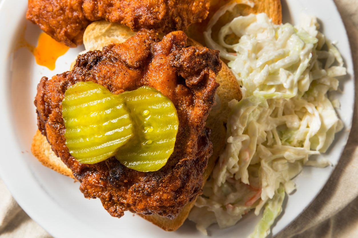 Nashville hot chicken served with pickles and slaw near Fairfield Inn Nashville MetroCenter